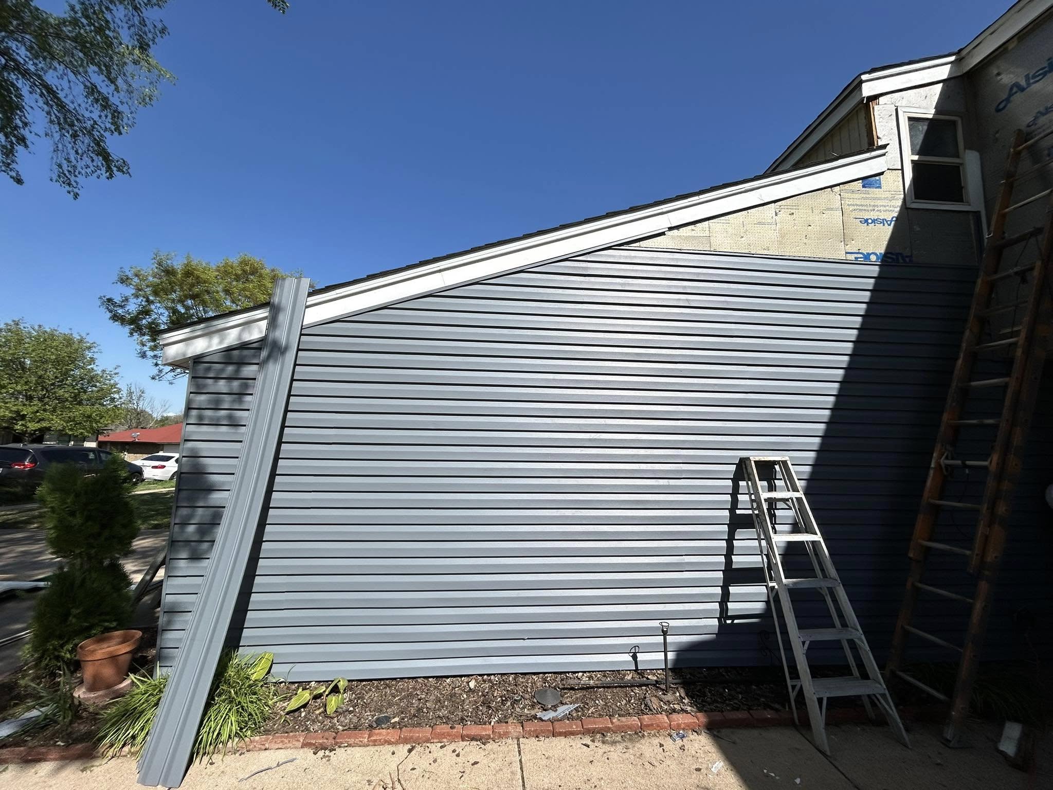 Hail damage on an Arlington Texas residential roof showing dented shingles