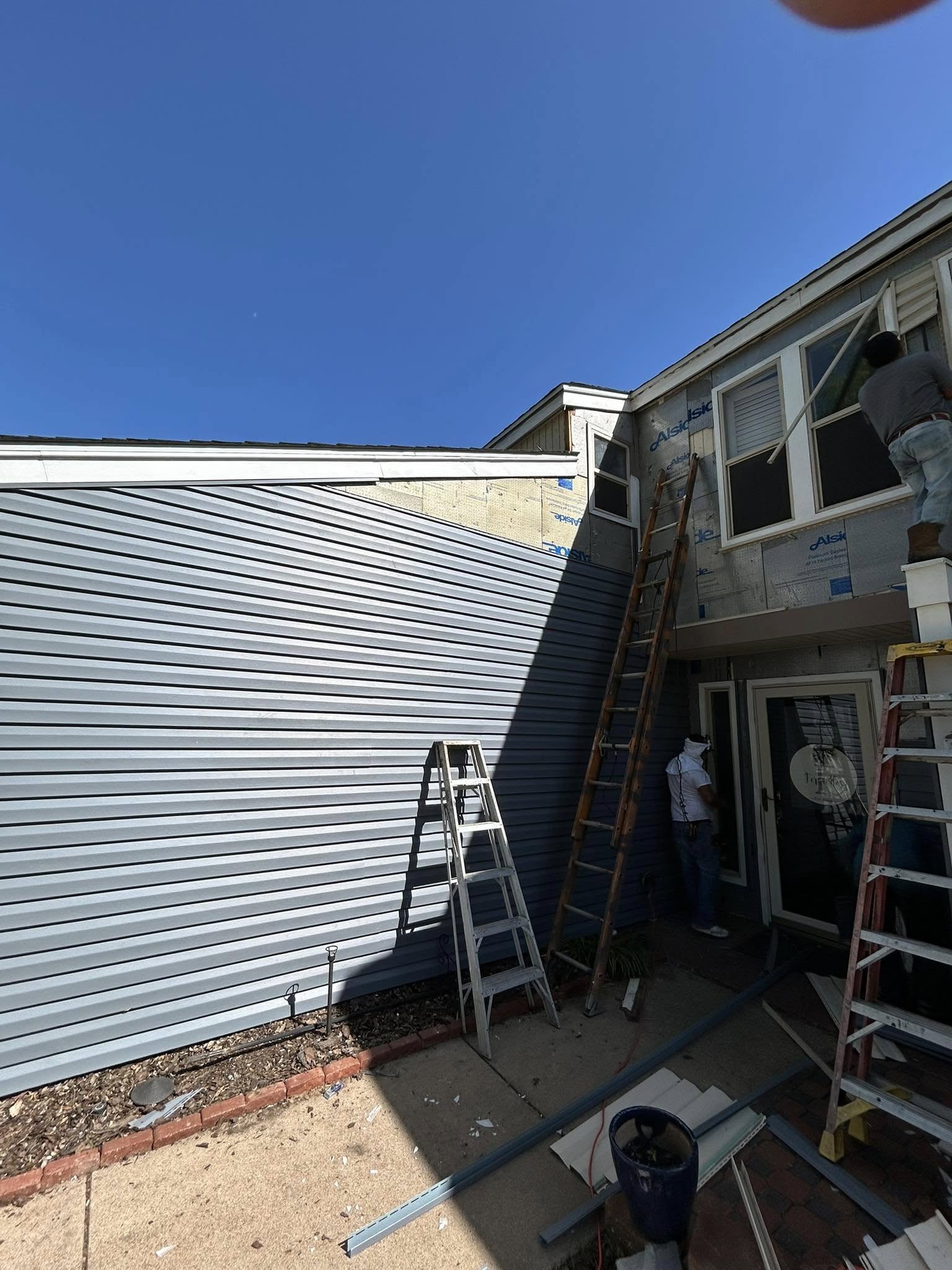 Wind-lifted shingles on a Carrollton Texas roof after a severe thunderstorm