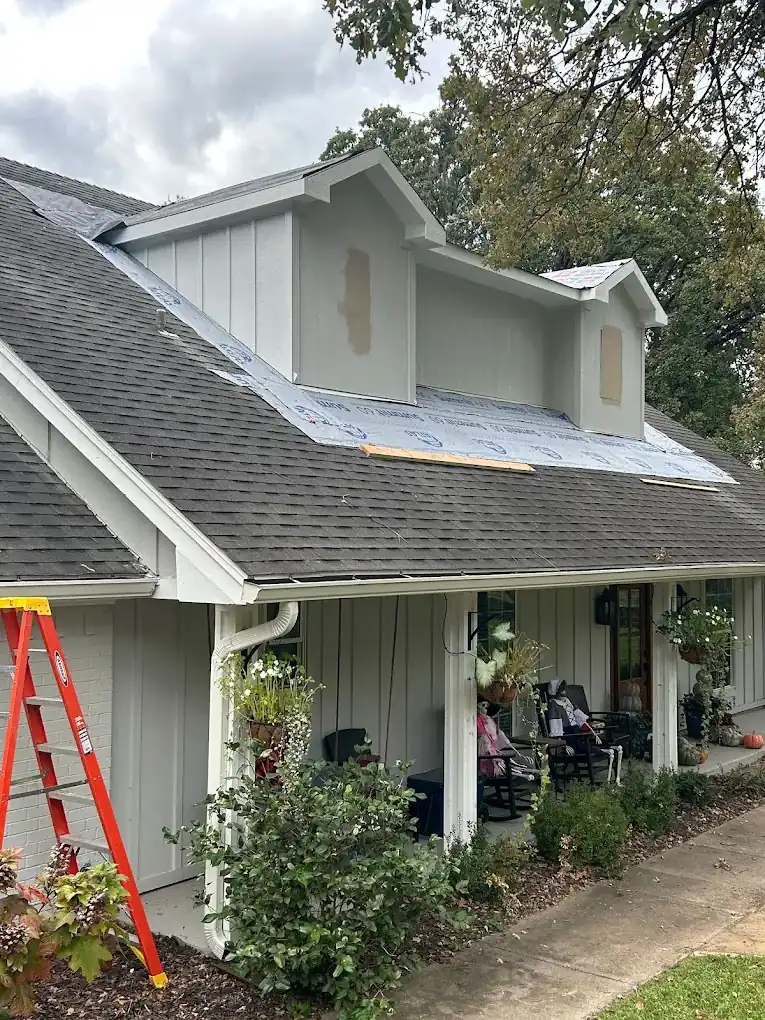 Dormer above a shingle roof