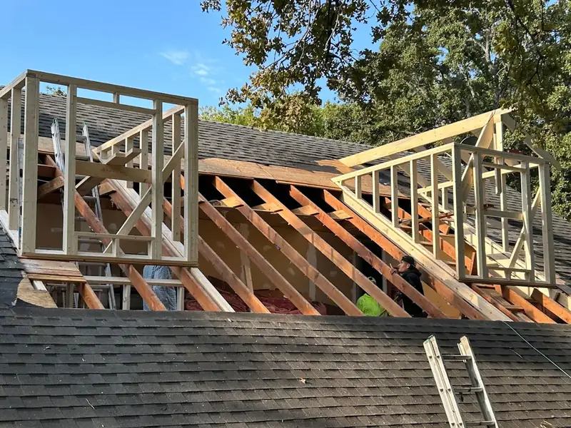 Exposed framing and roof structure during construction