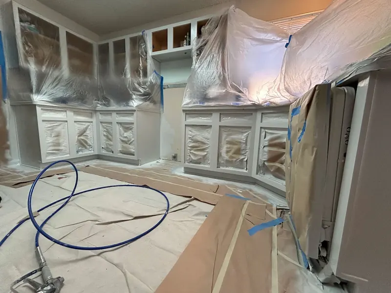 Interior work area with surfaces masked for finishing