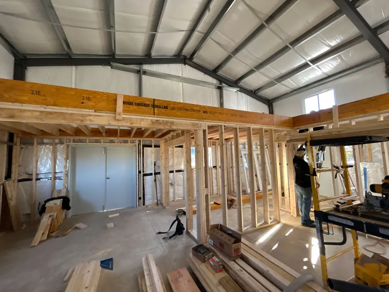 Interior framing below a metal roof structure